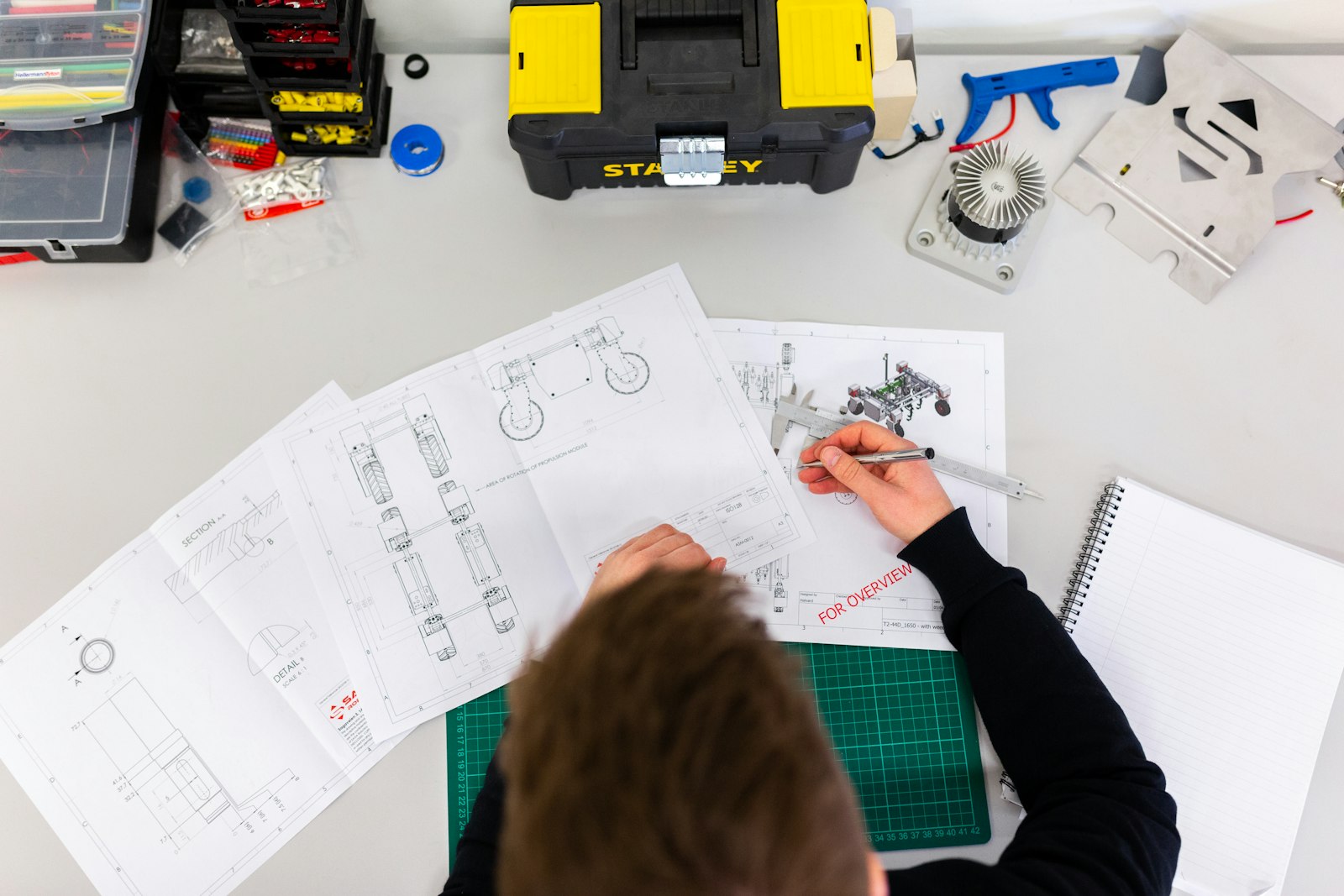 Engineer drafting robot design schematics