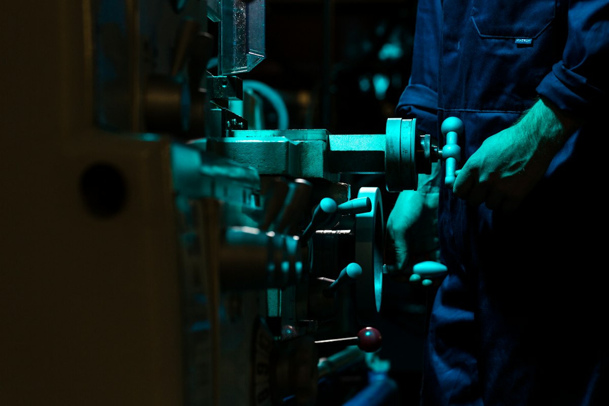 Engineer operating precision machinery